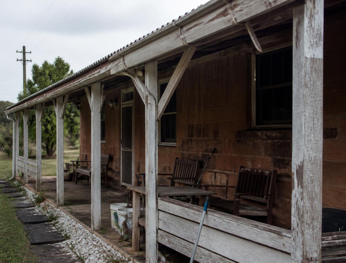 Weathered timber awning before restoration
